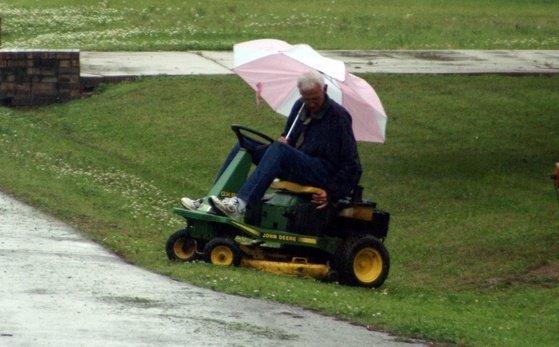 Mowing grass in rain sale